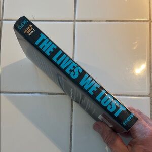The Lives We Lost Hardcover Book